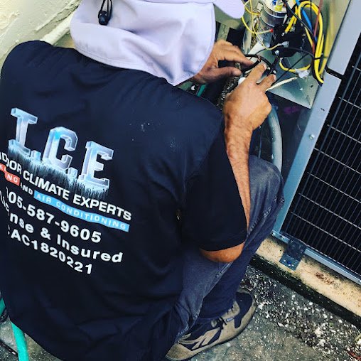Indoor Climate Experts technician repairing an air conditioner in Winter Haven, FL