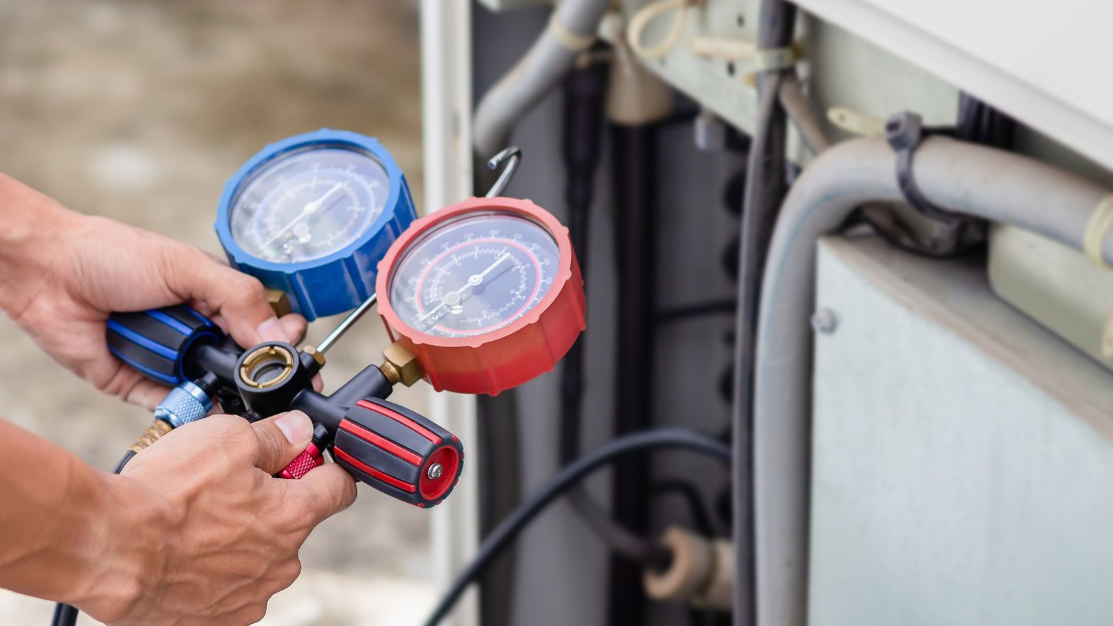 Indoor Climate Experts HVAC technician servicing AC unit in Lakeland, FL
