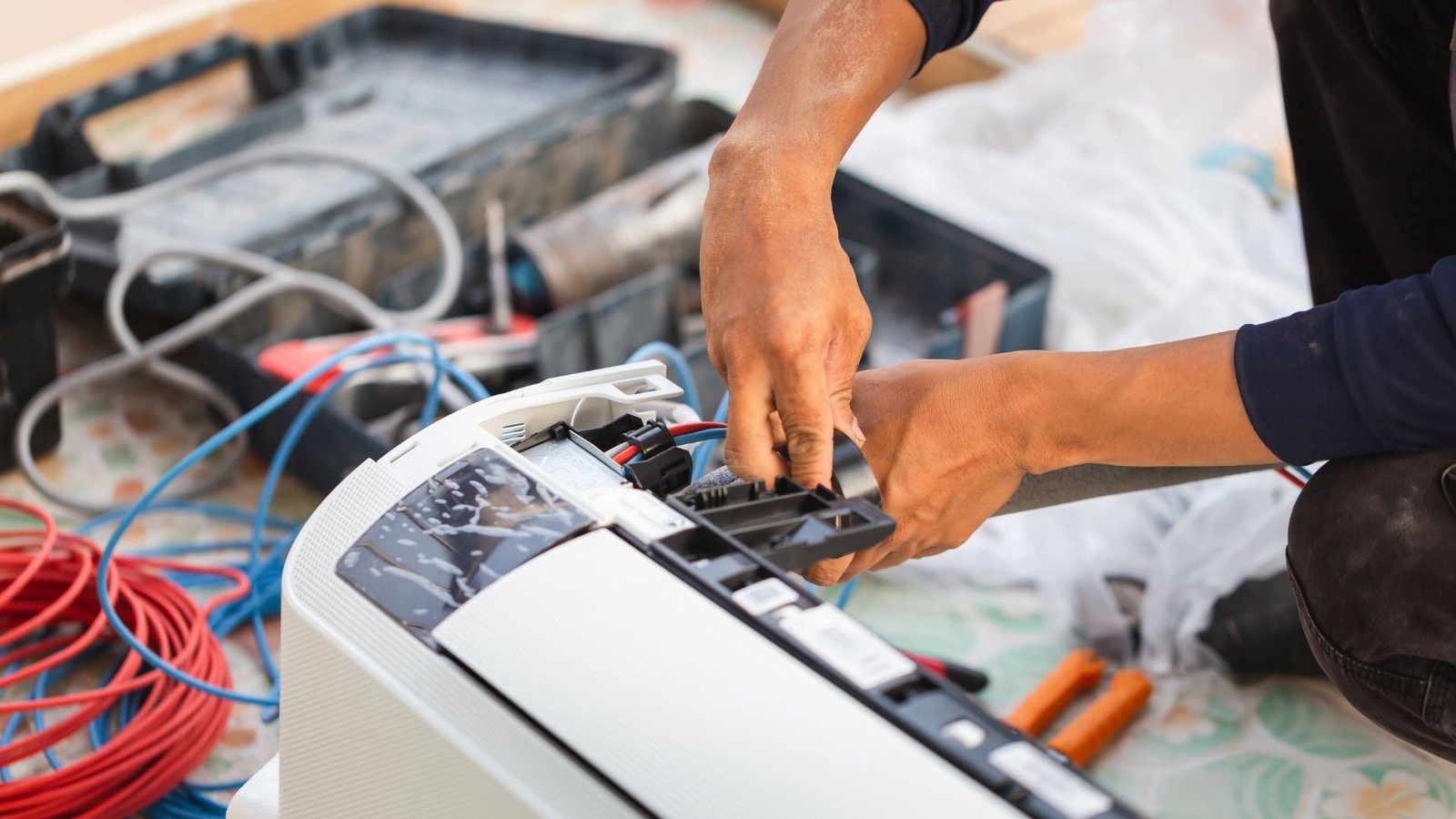 Indoor Climate Experts HVAC technician servicing AC unit in Lakeland, FL