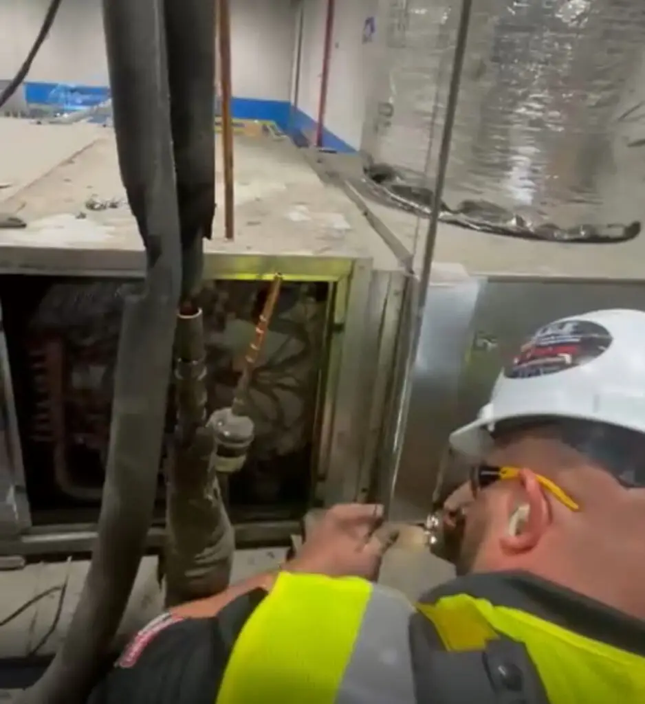 Indoor Climate Experts technician on an emergency HVAC repair in Winter Haven, FL